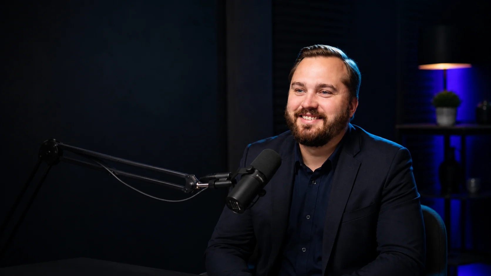 Ben Langner recording a podcast in studio